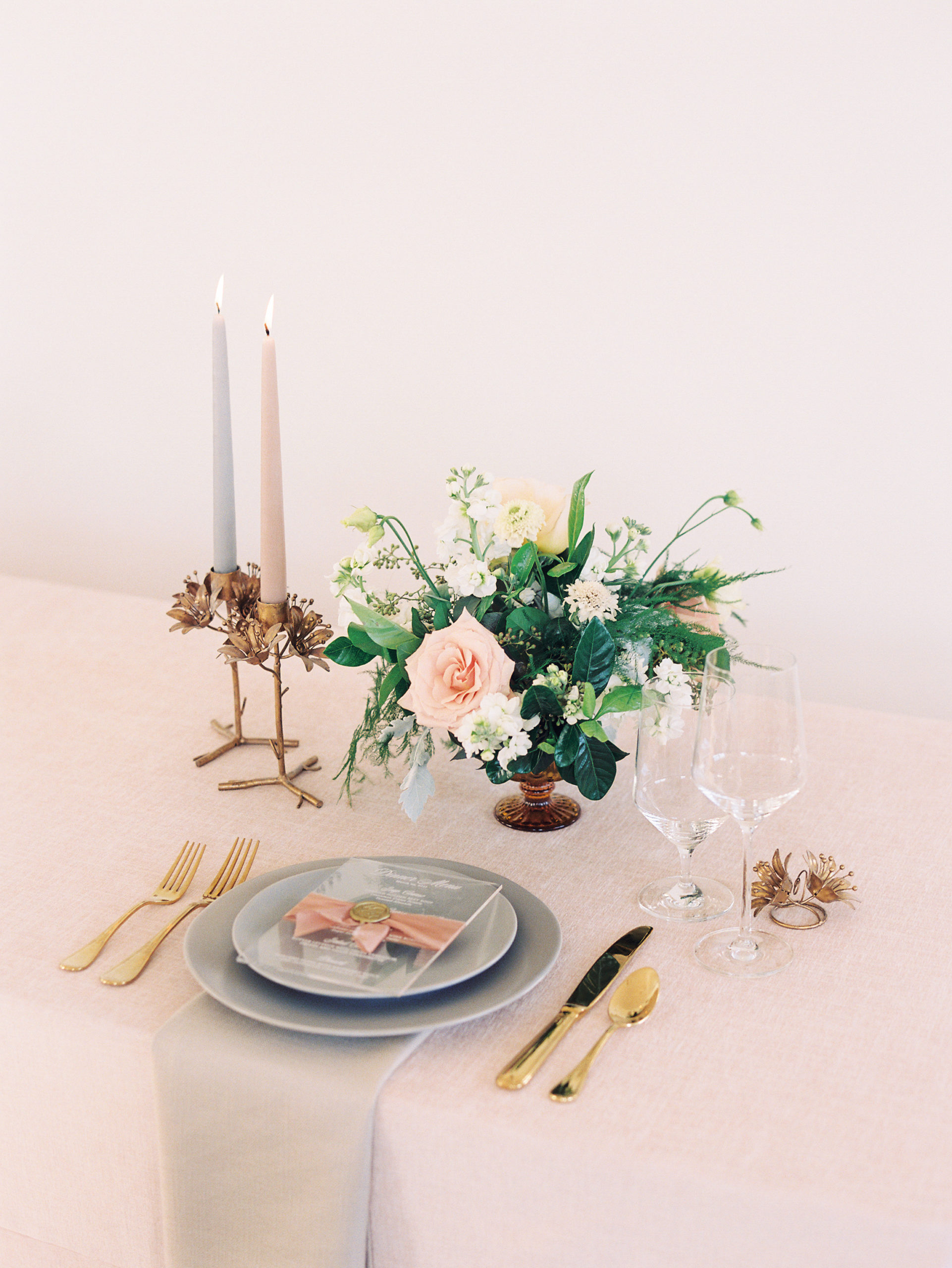 FRENCH DOOR EVENTS tablescape of pink and gray tones with a floral arrangement